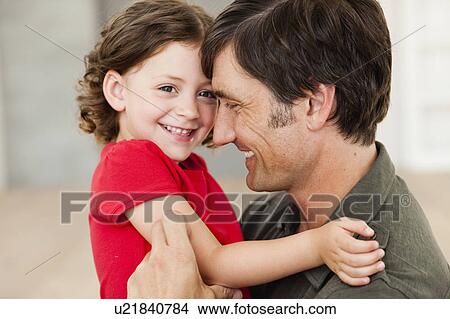 Picture - father tickling daughter. Fotosearch
