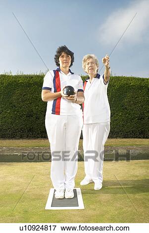 Stock Photo - female bowlers discussing tactics. Fotosearch