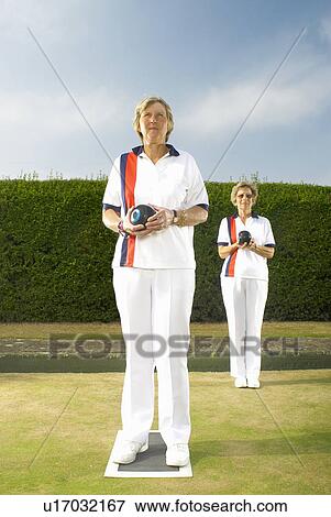 Stock Photo - female bowls players on green. Fotosearch