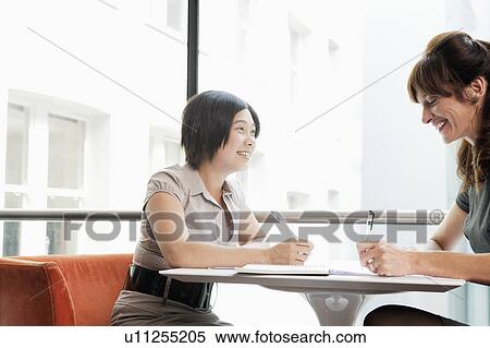 Female couple working at a restaurant View Large Photo Image Stock Photography - Female couple working at a restaurant. Fotosearch