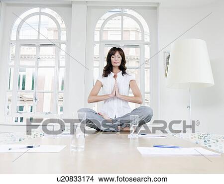 Picture - Female doing a yoga pose. Fotosearch