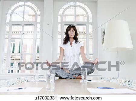Female doing a yoga pose View Large Photo Image Stock Image - Female doing a yoga pose. Fotosearch