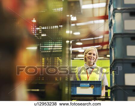 Female Factory Worker Packing Boxes View Large Photo Image Stock Photo - Female Factory Worker Packing Boxes. Fotosearch