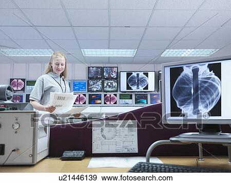 Female Fusion Scientist With Screens View Large Photo Image Stock Photo - Female Fusion Scientist With Screens. Fotosearch