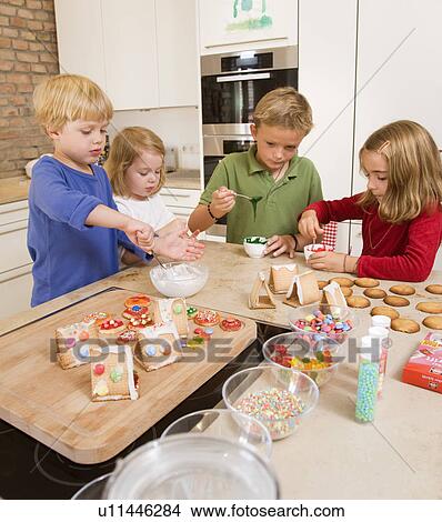 four kids baking cookies View Large Photo Image Picture - four kids baking cookies. Fotosearch