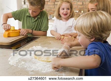 four kids baking cookies View Large Photo Image Stock Image - four kids baking cookies. Fotosearch