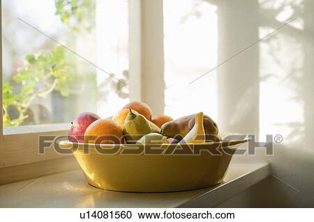 Fruit basket on a windowsill View Large Photo Image Stock Image - Fruit basket on a windowsill. Fotosearch