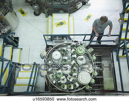 Stock Image - Fusion Reactor Scientist At Work. Fotosearch