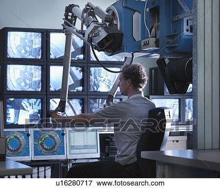 Stock Photo - Fusion Reactor Scientist At Work. Fotosearch