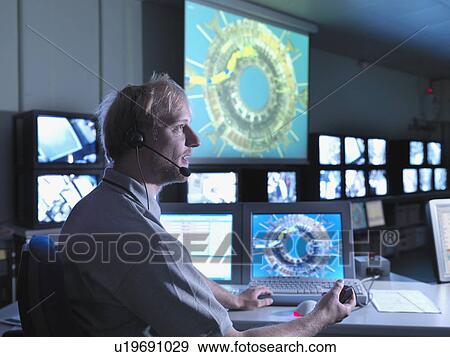 Fusion Reactor Scientist At Work View Large Photo Image Stock Photo - Fusion Reactor Scientist At Work. Fotosearch