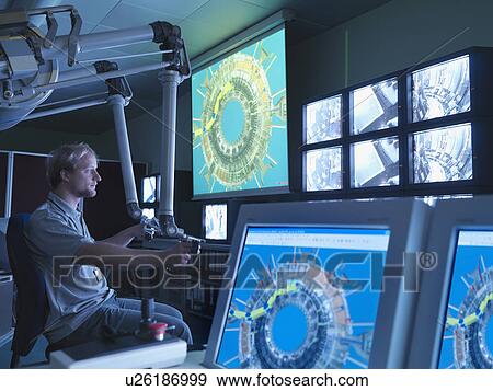 Stock Photo - Fusion Reactor Scientist At Work. Fotosearch