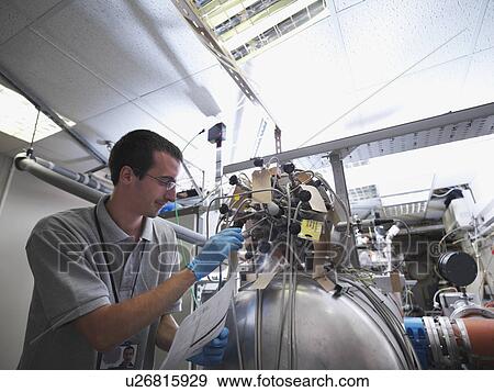 Fusion Reactor Scientist At Work View Large Photo Image Stock Photo - Fusion Reactor Scientist At Work. Fotosearch