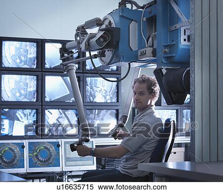 Stock Photography - Fusion Reactor Scientist At Work. Fotosearch