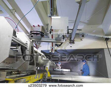 Stock Photo - Fusion Reactor Scientist In Tunnel. Fotosearch