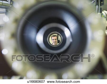Stock Photo - Fusion Reactor Scientist Through Tube. Fotosearch