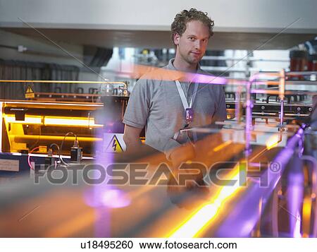 Stock Image - Fusion Reactor Scientist With Lasers. Fotosearch