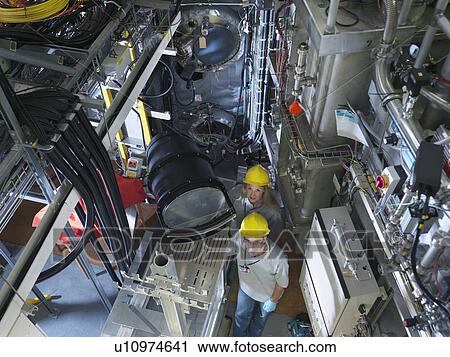 Stock Image - Fusion Reactor Scientists At Work. Fotosearch
