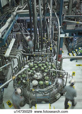 Stock Photo - Fusion Reactor Scientists At Work. Fotosearch