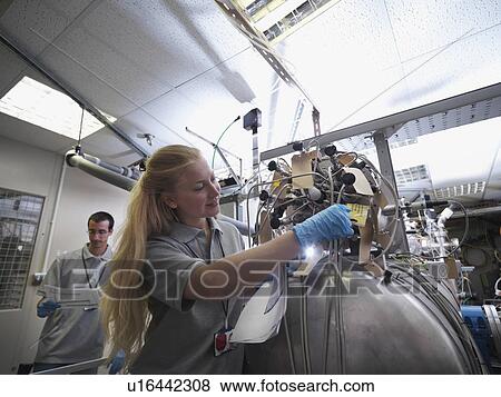 Fusion Reactor Scientists At Work View Large Photo Image Stock Photo - Fusion Reactor Scientists At Work. Fotosearch