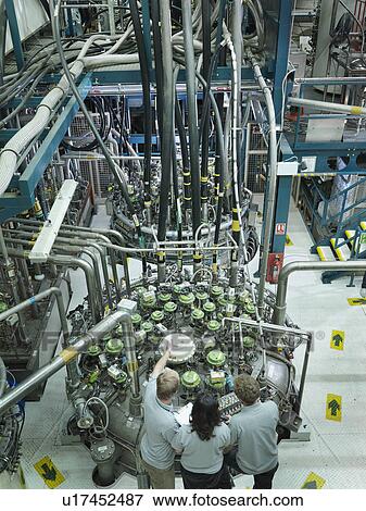 Stock Photo - Fusion Reactor Scientists At Work. Fotosearch