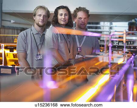 Stock Photo - Fusion Reactor Scientists With Lasers. Fotosearch