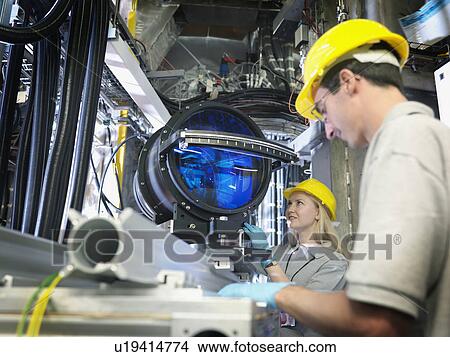Fusion Reactor Scientists With Lens View Large Photo Image Picture - Fusion Reactor Scientists With Lens. Fotosearch