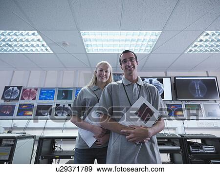 Fusion Reactor Scientists With Screens View Large Photo Image Stock Photo - Fusion Reactor Scientists With Screens. Fotosearch