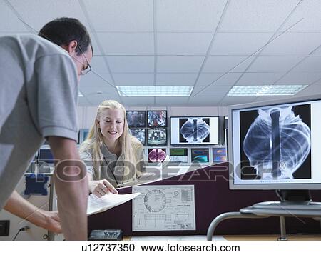 Fusion Scientists Discussing Work View Large Photo Image Stock Image - Fusion Scientists Discussing Work. Fotosearch