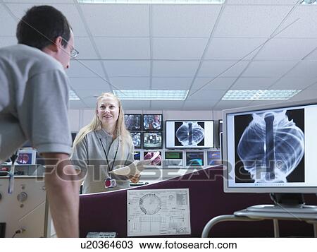 Fusion Scientists Discussing Work View Large Photo Image Stock Image - Fusion Scientists Discussing Work. Fotosearch