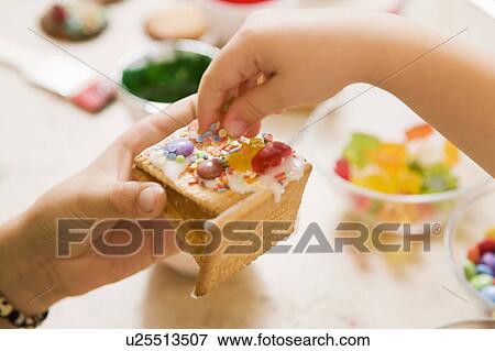 girl and boy decorating cookies View Large Photo Image Stock Photo - girl and boy decorating cookies. Fotosearch
