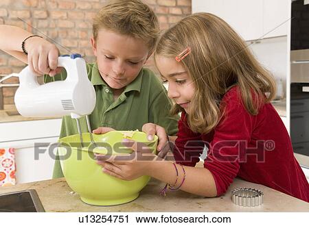 girl and boy stirring dough View Large Photo Image Stock Image - girl and boy stirring dough. Fotosearch