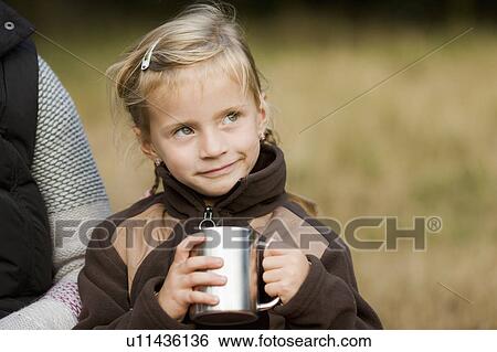 Stock Photograph - girl at a picnic. Fotosearch