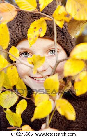 Girl behind a tree limb View Large Photo Image Stock Photography - Girl behind a tree limb. Fotosearch
