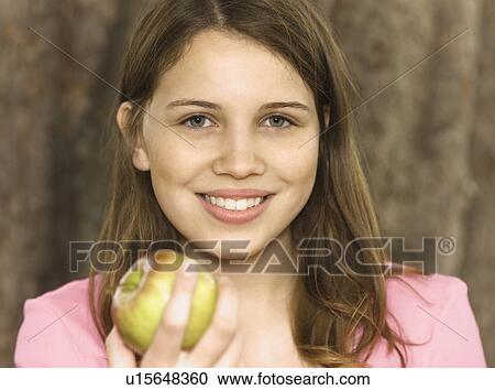 Girl eating apple View Large Photo Image Stock Image - Girl eating apple. Fotosearch