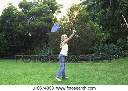 Girl holding butterfly net View Large Photo Image Stock Image - Girl holding butterfly net. Fotosearch