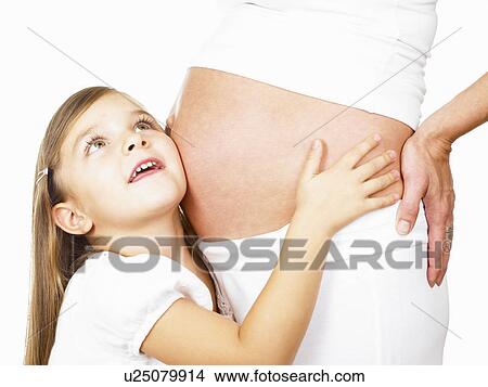 Girl holding her mother's pregnant belly View Large Photo Image Picture - Girl holding her mother's pregnant belly. Fotosearch