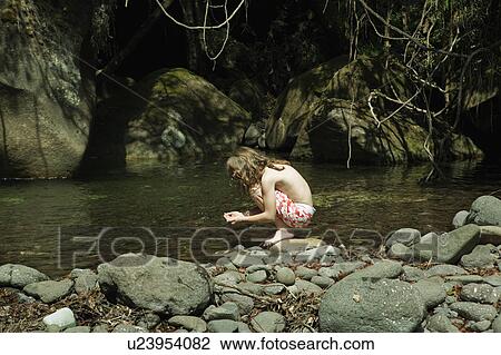 Girl holding water in hand View Large Photo Image Stock Image - Girl holding water in hand. Fotosearch