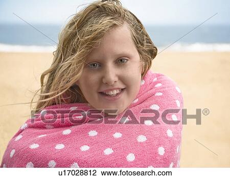 Girl in towel on beach View Large Photo Image Stock Image - Girl in towel on beach. Fotosearch