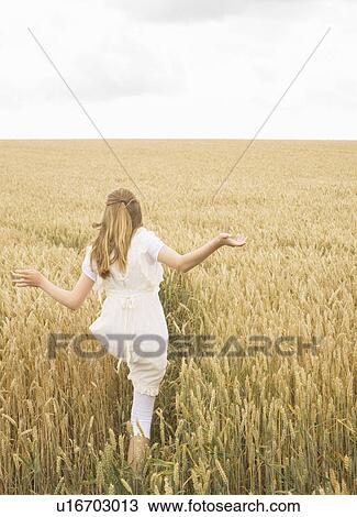 Girl in wheat Field View Large Photo Image Stock Image - Girl in wheat Field. Fotosearch