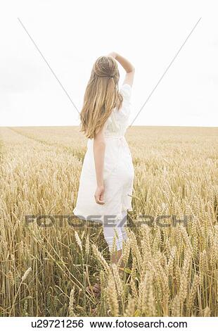 Girl in wheat Field View Large Photo Image Stock Photograph - Girl in wheat Field. Fotosearch