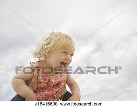 Girl lifted into air View Large Photo Image Stock Photo - Girl lifted into air. Fotosearch