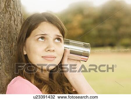 Girl Listening to Tin Can Phone View Large Photo Image Stock Image - Girl Listening to Tin Can Phone. Fotosearch