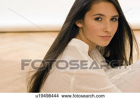 Picture - girl looking into camera. Fotosearch