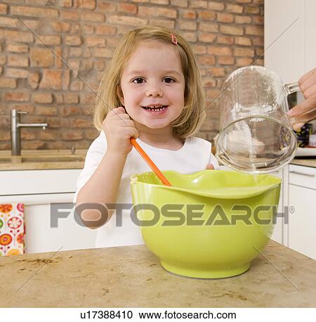 girl mixing ingredients in bowl View Large Photo Image Stock Image - girl mixing ingredients in bowl. Fotosearch