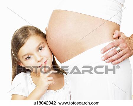 Girl next to her mother's pregnant belly View Large Photo Image Stock Image - Girl next to her mother's pregnant belly. Fotosearch
