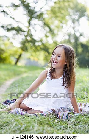 girl on blanket smiling View Large Photo Image Stock Photograph - girl on blanket smiling. Fotosearch