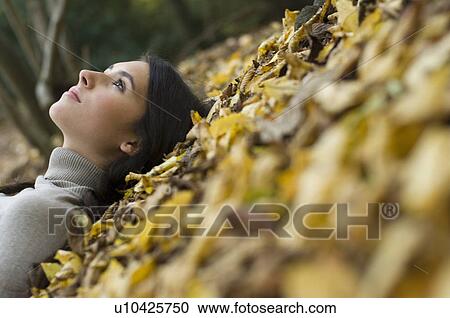 girl on leaves View Large Photo Image Stock Image - girl on leaves. Fotosearch