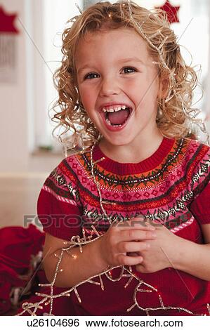 girl playing with christmas decoration View Large Photo Image Stock Photograph - girl playing with christmas decoration. Fotosearch