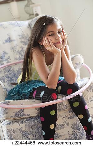 girl sitting on chair View Large Photo Image Stock Photo - girl sitting on chair. Fotosearch
