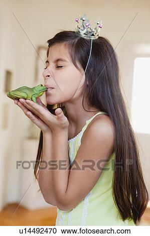 girl wearing crown kissing toy frog View Large Photo Image Stock Image - girl wearing crown kissing toy frog. Fotosearch